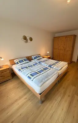 Ein Bett oder Betten in einem Zimmer der Unterkunft Saas-Fee Swiss Vacances