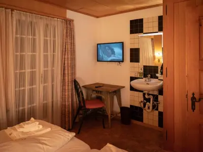 Ein Bett oder Betten in einem Zimmer der Unterkunft Apartment Chalet Turquino - Apartment Marmotte by Interhome