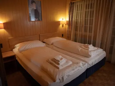 Ein Bett oder Betten in einem Zimmer der Unterkunft Apartment Chalet Turquino - Apartment Marmotte by Interhome