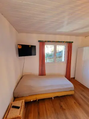 Ein Bett oder Betten in einem Zimmer der Unterkunft Kunstplanet im Herzen der Alpen am Planetenweg