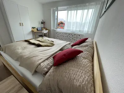 Ein Bett oder Betten in einem Zimmer der Unterkunft Sunny Alps View: Central Bliss