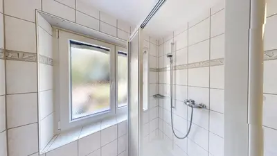 Ein Badezimmer in der Unterkunft Floralpina FL1
