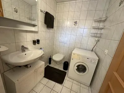 Ein Badezimmer in der Unterkunft 250m zur Hannigalp und Bergpanorama