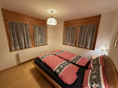 Ein Bett oder Betten in einem Zimmer der Unterkunft 250m zur Hannigalp und Bergpanorama