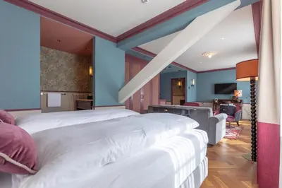 Ein Bett oder Betten in einem Zimmer der Unterkunft Hotel Mürren Palace