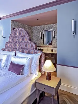 Ein Bett oder Betten in einem Zimmer der Unterkunft Hotel Mürren Palace