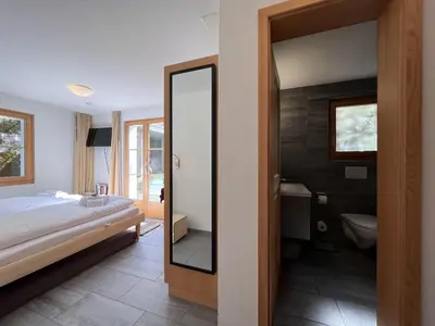 Ein Bett oder Betten in einem Zimmer der Unterkunft Chalet Bergrose 3