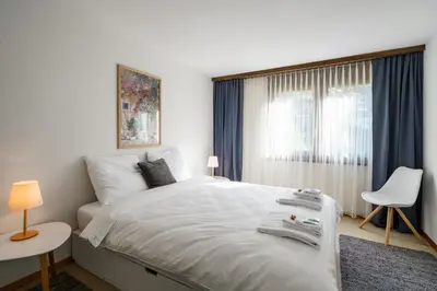 Ein Bett oder Betten in einem Zimmer der Unterkunft Chalet Krokus 6
