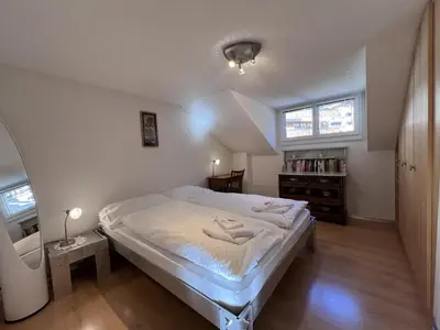 Ein Bett oder Betten in einem Zimmer der Unterkunft Chalet Tilia Penthouse