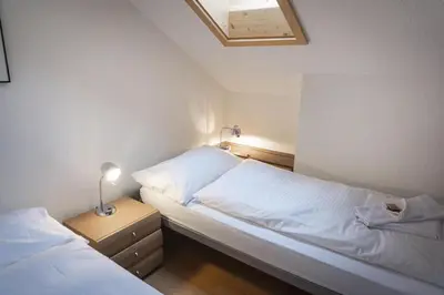 Ein Bett oder Betten in einem Zimmer der Unterkunft Chalet Tilia Penthouse