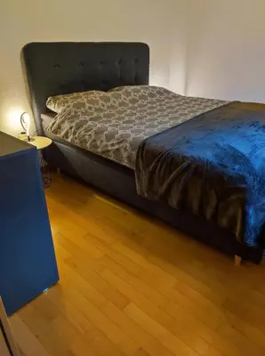 Ein Bett oder Betten in einem Zimmer der Unterkunft Appartement in St. Niklaus