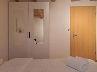 Ein Bett oder Betten in einem Zimmer der Unterkunft Family-friendly apartment with Alpine view