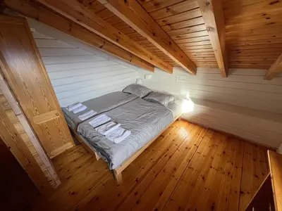 Ein Bett oder Betten in einem Zimmer der Unterkunft Superbe chalet 12 personnes vue imprenable 2nuits min