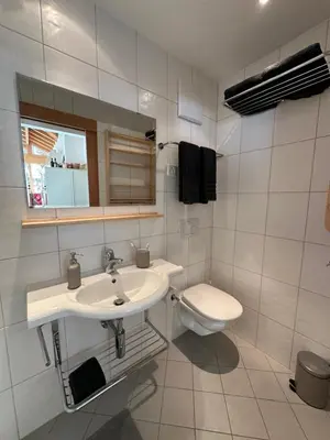 Ein Badezimmer in der Unterkunft Modern self-catering apartment with Matterhorn views