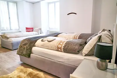 Ein Bett oder Betten in einem Zimmer der Unterkunft Tripple Room with Bathroom.
