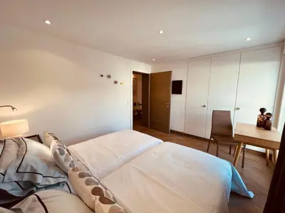 Ein Bett oder Betten in einem Zimmer der Unterkunft Exclusive Comfy Apartment in Central Crans-Montana