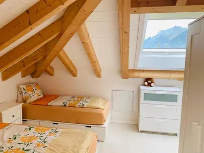Ein Bett oder Betten in einem Zimmer der Unterkunft Al Porto Fantastic Lake & Mountain View Apartment