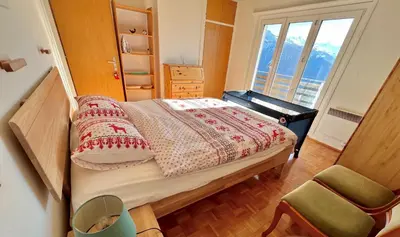 Ein Bett oder Betten in einem Zimmer der Unterkunft Chalet La Louise avec vue imprenable