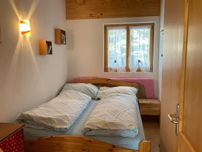 Ein Bett oder Betten in einem Zimmer der Unterkunft Chalet Lalula