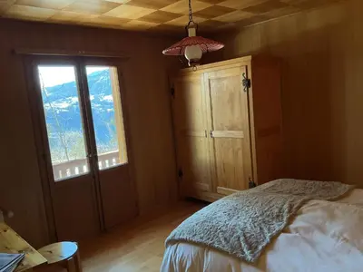 Ein Bett oder Betten in einem Zimmer der Unterkunft Chalet Privé avec vue imprenable sur les alpes