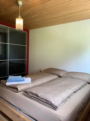 Ein Bett oder Betten in einem Zimmer der Unterkunft Lina - Lakeview Living near Interlaken
