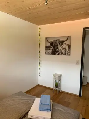 Ein Bett oder Betten in einem Zimmer der Unterkunft Lina - Lakeview Living near Interlaken