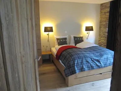 Ein Bett oder Betten in einem Zimmer der Unterkunft Swissalpschalet 4-5 Check also our new home Swissalpschalet 6 PRO
