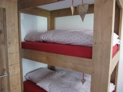 Ein Bett oder Betten in einem Zimmer der Unterkunft Swissalpschalet 4-5 Check also our new home Swissalpschalet 6 PRO