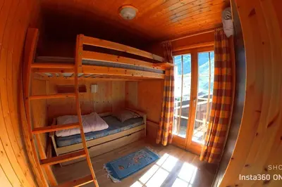Ein Bett oder Betten in einem Zimmer der Unterkunft Stecaya Face à la piste de l'Aigle