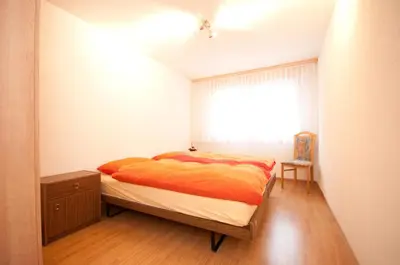 Ein Bett oder Betten in einem Zimmer der Unterkunft Alpbachstrasse 4, Meiringen