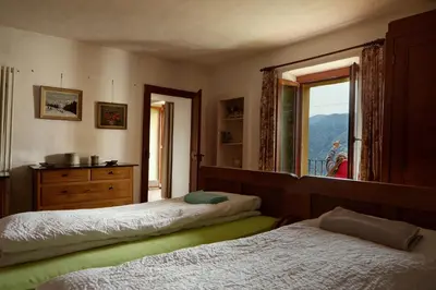 Ein Bett oder Betten in einem Zimmer der Unterkunft Wild Valley Garden Paradise in Valle Onsernone