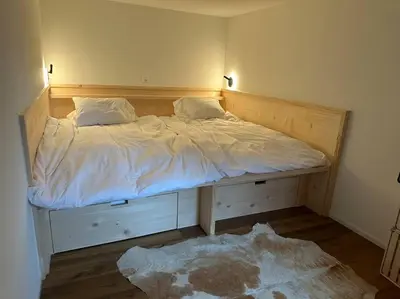 Ein Bett oder Betten in einem Zimmer der Unterkunft Region de Gstaad - Ultra Modern Apartment- Huge Roof Terrace - Great Views