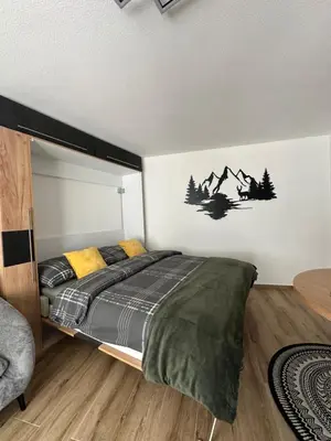 Ein Bett oder Betten in einem Zimmer der Unterkunft Studio magnifique avec terrasse spacieuse Loèche-les-Bains Vacances