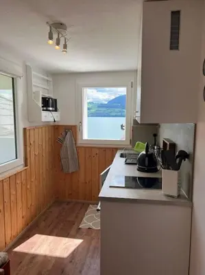 Küche/Küchenzeile in der Unterkunft Bijou Loft - Charming Loft on Lake Thun near Interlaken