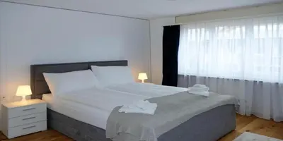 Ein Bett oder Betten in einem Zimmer der Unterkunft Mariposa Spiez