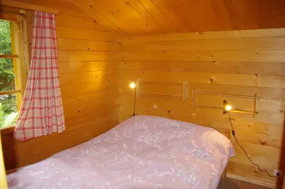 Ein Bett oder Betten in einem Zimmer der Unterkunft Le Bouvreuil Zinal, le VRAI petit chalet de vacances!