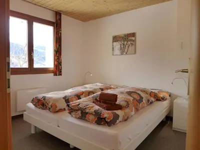 Ein Bett oder Betten in einem Zimmer der Unterkunft Apartment Chalet Gredetsch 6B by Interhome