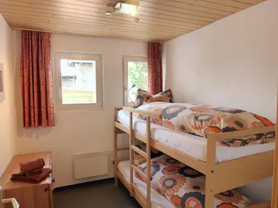 Ein Bett oder Betten in einem Zimmer der Unterkunft Apartment Chalet Gredetsch 6B by Interhome