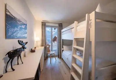 Ein Bett oder Betten in einem Zimmer der Unterkunft Chalet Huttli