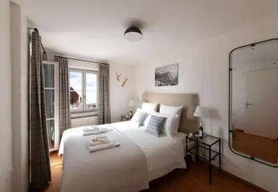 Ein Bett oder Betten in einem Zimmer der Unterkunft Chalet Huttli