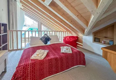 Ein Bett oder Betten in einem Zimmer der Unterkunft Chalet Belmont Penthouse