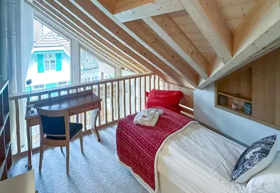 Ein Bett oder Betten in einem Zimmer der Unterkunft Chalet Belmont Penthouse
