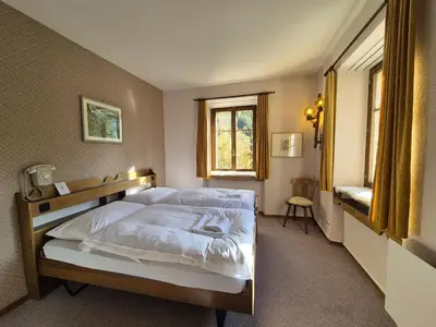 Ein Bett oder Betten in einem Zimmer der Unterkunft Lötschberg Zentrum