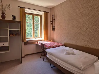 Ein Bett oder Betten in einem Zimmer der Unterkunft Lötschberg Zentrum