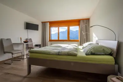 Ein Bett oder Betten in einem Zimmer der Unterkunft Ferienwohnungen Zurschmitten