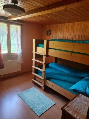 Ein Bett oder Betten in einem Zimmer der Unterkunft Ferienwohnung Berner Oberland - Guttannen