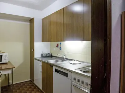 Küche/Küchenzeile in der Unterkunft Apartment Eden Roc 56 by Interhome