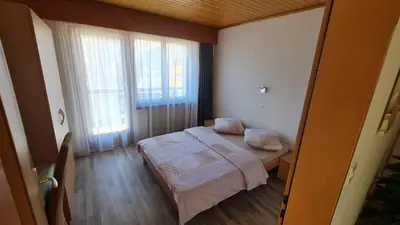Ein Bett oder Betten in einem Zimmer der Unterkunft Pension Taverne