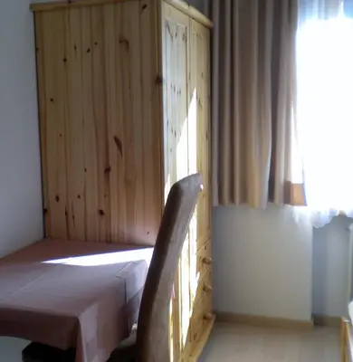 Ein Bett oder Betten in einem Zimmer der Unterkunft Pension Taverne