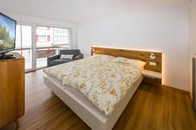 Ein Bett oder Betten in einem Zimmer der Unterkunft Moderne Wohnung Jungtal
